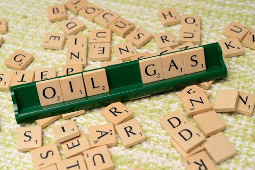 Creative depiction of the oil and gas industry using letter tiles.