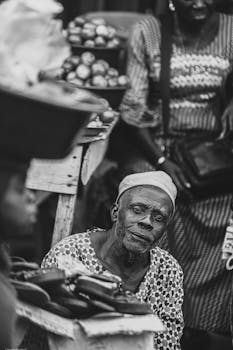 Captivating black and white portrait capturing the essence of market life in Ikorodu, Nigeria.